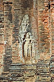 Bakong temple - devata on the ancillary tower.